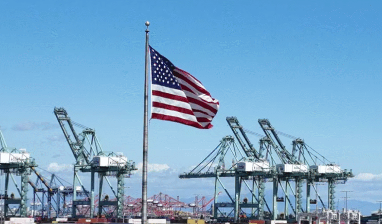 A cargo ship unloads containers at a U.S. port as tariffs and import prices draw attention