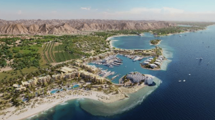 All-inclusive Red Sea resort with landscaped gardens, pools, and direct beach access under clear blue skies.